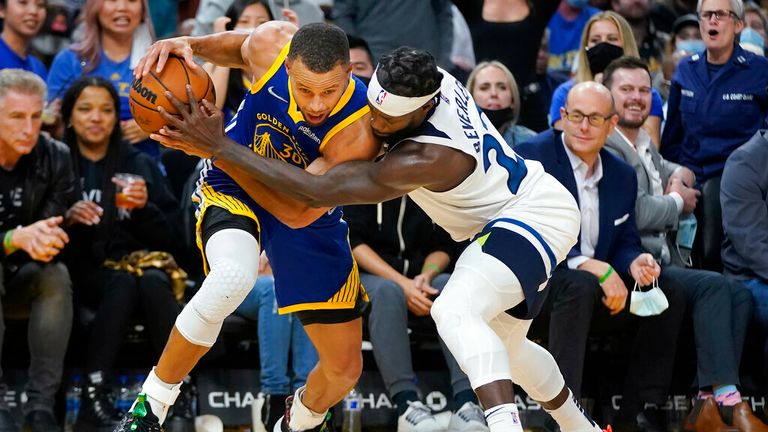 Golden State Warriors guard Stephen Curry, left, is defended by Minnesota Timberwolves guard Patrick Beverley during the second half of an NBA basketball game in San Francisco, Wednesday, Nov. 10, 2021. (AP Photo/Jeff Chiu)