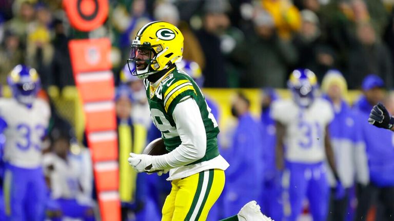 Green Bay Packers&#39; Rasul Douglas runs for a touchdown after after intercepting a pass during the second half of an NFL football game against the Los Angeles Rams Sunday, Nov. 28, 2021, in Green Bay, Wis. (AP Photo/Matt Ludtke)