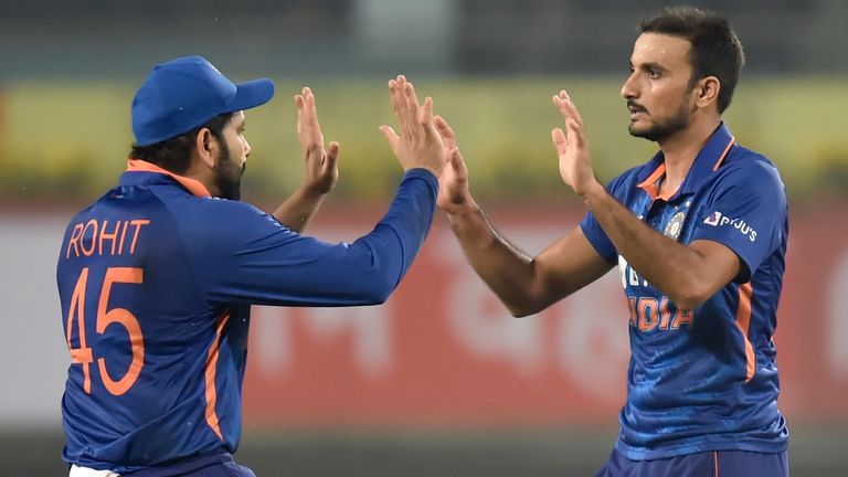 Harshal Patel of India celebrates the wicket of Glenn Phillips of New Zealand with teammate Rohit Sharma during the T20 International Match between India and New Zealand at JSCA International Stadium Complex on November 19, 2021 in Ranchi, India.