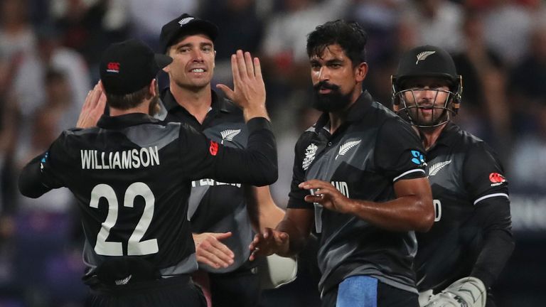 New Zealand's Ish Sodhi, without cap, celebrates the dismissal of England's Jos Buttler during the Cricket Twenty20 World Cup semi-final match between England and New Zealand in Abu Dhabi