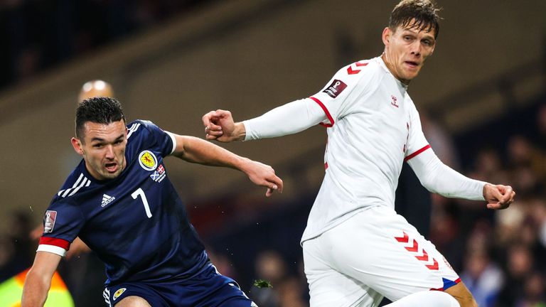 GLASGOW, SCOTLAND - NOVEMBER 15: Scotland's John McGinn and Jannik Vestergaard in action during a FIFA World Cup Qualifier between Scotland and Denmark at Hampden Park, on November 15, 2021, in Glasgow, Scotland. (Photo by Craig Williamson / SNS Group)