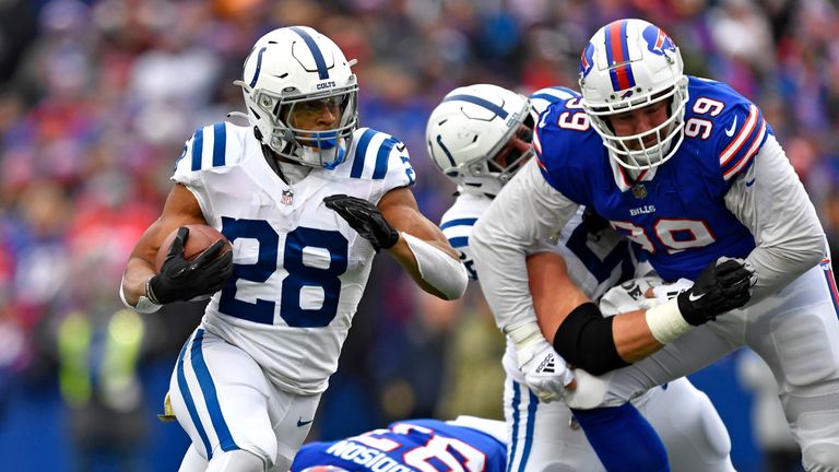 Indianapolis Colts running back Jonathan Taylor (28) carries the football during the first half of an NFL football game against the Buffalo Bills in Orchard Park, N.Y., Sunday, Nov. 21, 2021. (AP Photo/Adrian Kraus)



