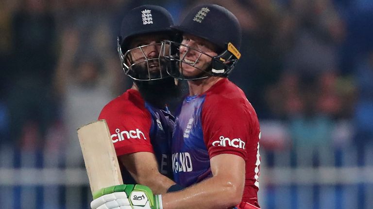 England's Moeen Ali, left, hugs teammate Jos Buttler after Buttler scored a century during the Cricket Twenty20 World Cup match between England and Sri Lanka in Sharjah, UAE.