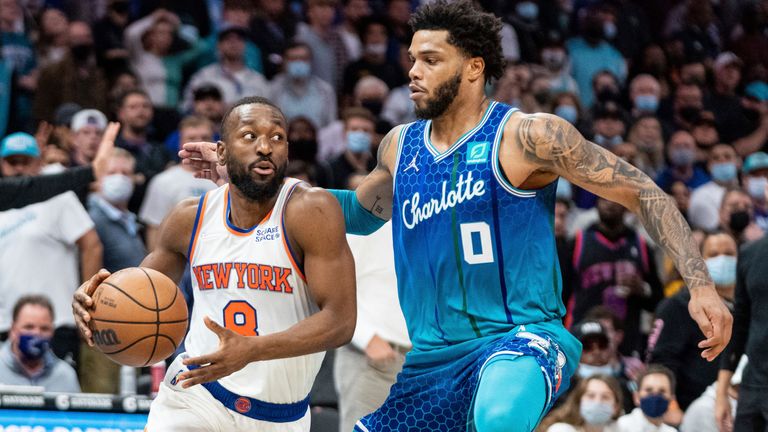 Charlotte Hornets forward Miles Bridges guards New York Knicks guard Kemba Walker