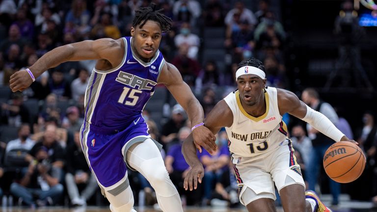 Sacramento Kings guard Davion Mitchell defends New Orleans Pelicans guard Kira Lewis Jr.