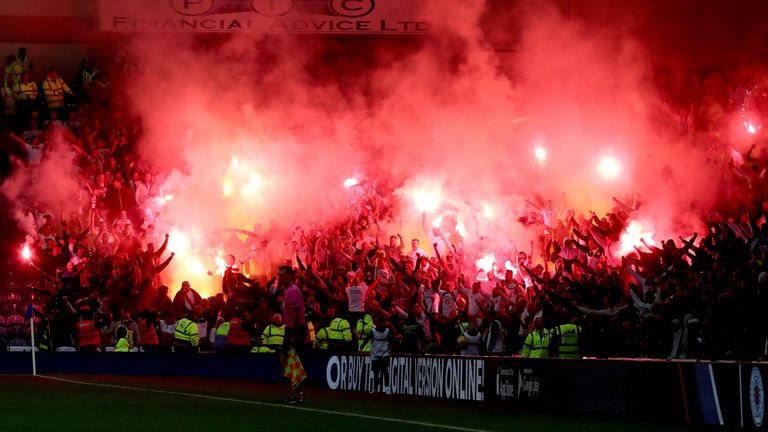 Visiting Legia Warsaw spectators light flares during the Europa League match against Leicester City at the King Power Stadium