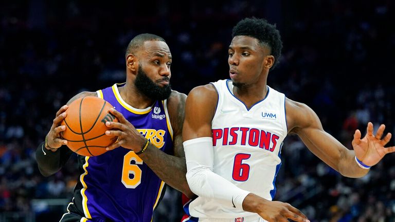 Los Angeles Lakers forward LeBron James (6) is defended by Detroit Pistons guard Hamidou Diallo (6) during the first half of an NBA basketball game, Sunday, Nov. 21, 2021, in Detroit. (AP Photo/Carlos Osorio)