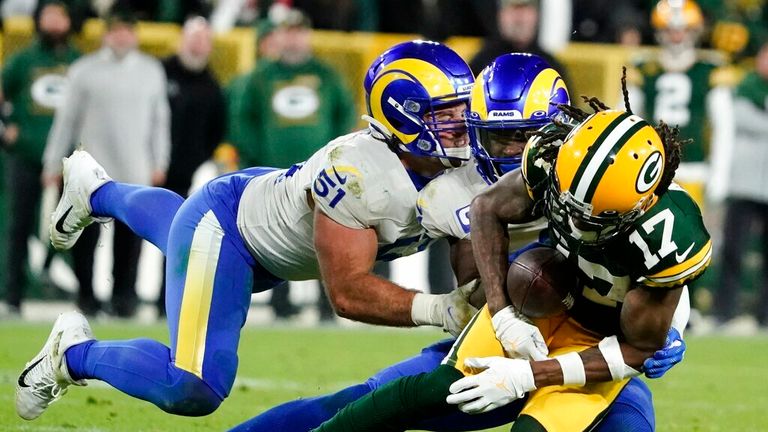 Los Angeles Rams&#39; Troy Reeder and Jalen Ramsey break up a pass intended for Green Bay Packers&#39; Davante Adams during the second half of an NFL football game Sunday, Nov. 28, 2021, in Green Bay, Wis. (AP Photo/Morry Gash)