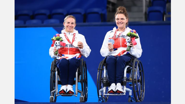 TOKYO, JAPAN - SEPTEMBER 04: Silver medalist Lucy Shuker (L) and Jordanne Whiley of Team Great Britain celebrate during the medal ceremony for the Women's Doubles Gold Medal Match on day 11 of the Tokyo 2020 Paralympic Games at Ariake Tennis Park on September 04, 2021 in Tokyo, Japan. (Photo by Carmen Mandato/Getty Images)