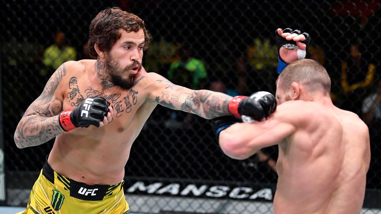 Marlon Vera strikes Davey Grant during their bantamweight bout at UFC Fight Night in June