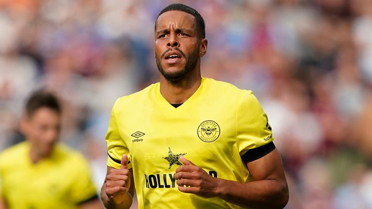 Brentford defender Mathias Zanka Jorgensen (22) runs up the pitch during an English Premier League soccer match against West Ham United at London Stadium in London, Sunday, Oct. 3, 2021. Brentford won 2-1. (AP Photo/Steve Luciano)