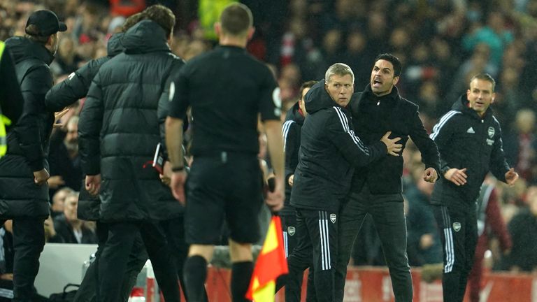 Mikel Arteta and Jurgen Klopp clash on the sideline at Anfield (AP)