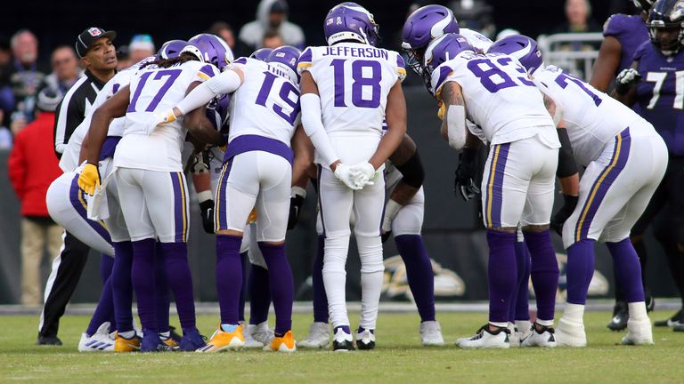 Minnesota Vikings players huddle