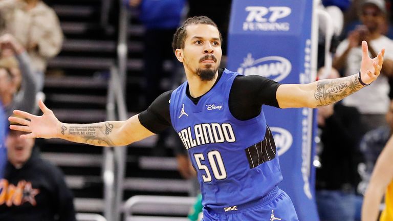 Orlando Magic guard Cole Anthony celebrates after slam-dunking during the second half of an NBA basketball game against the Utah Jazz, Sunday, Nov. 7, 2021, in Orlando, Fla.