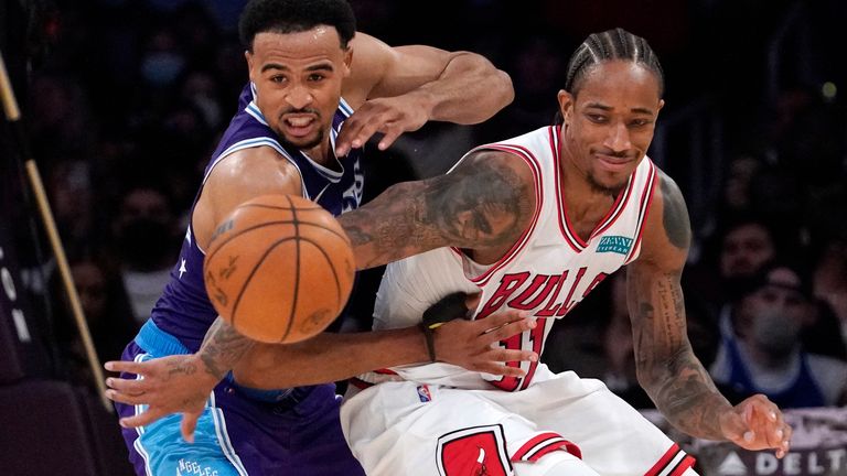Los Angeles Lakers guard Talen Horton-Tucker, left, and Chicago Bulls forward DeMar DeRozan reach for a loose ball during the second half of an NBA basketball game Monday, Nov. 15, 2021, in Los Angeles. The Bulls won 121-103.