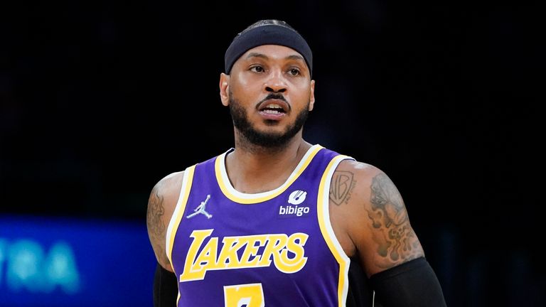 Los Angeles Lakers' Carmelo Anthony walks on the court during the first half of an NBA basketball game against the Cleveland Cavaliers Friday, Oct. 29, 2021, in Los Angeles. (AP Photo/Jae C. Hong)