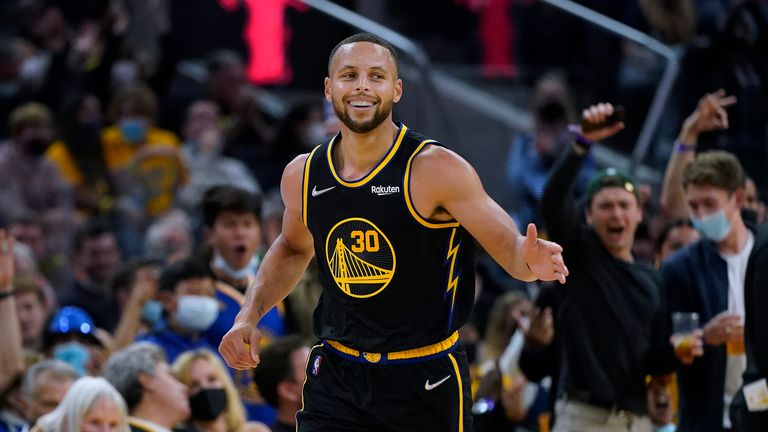 Golden State Warriors guard Stephen Curry (30) smiles after shooting a 3-point basket against the Portland Trail Blazers during the second half of an NBA basketball game in San Francisco, Friday, Nov. 26, 2021. (AP Photo/Jeff Chiu)


