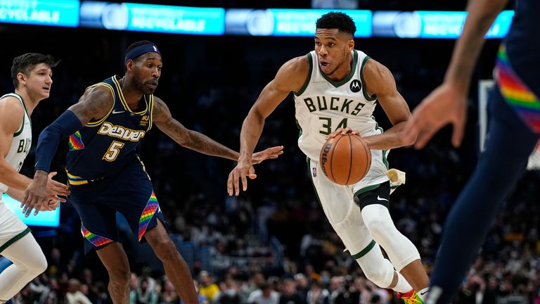 Milwaukee Bucks forward Giannis Antetokounmpo (34) drives to the basket against Denver Nuggets forward Will Barton (5) during the fourth quarter of an NBA basketball game Friday, Nov. 26, 2021, in Denver. (AP Photo/Jack Dempsey)


