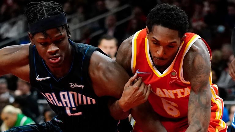 tlanta Hawks guard Lou Williams (6) and Orlando Magic center Mo Bamba (5) battle for the ball in the second half of an NBA basketball game Monday, Nov.  15, 2021, in Atlanta.