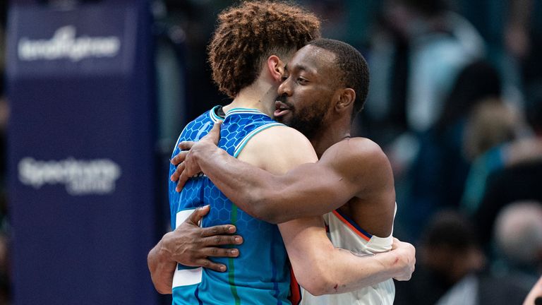 New York Knicks guard Kemba Walker embraces Charlotte Hornets guard LaMelo Ball after the buzzer