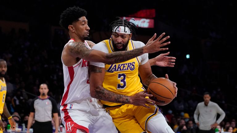 Los Angeles Lakers forward Anthony Davis (3) is defended by Houston Rockets center Christian Wood during the first half of an NBA basketball game Tuesday, Nov. 2, 2021, in Los Angeles.
