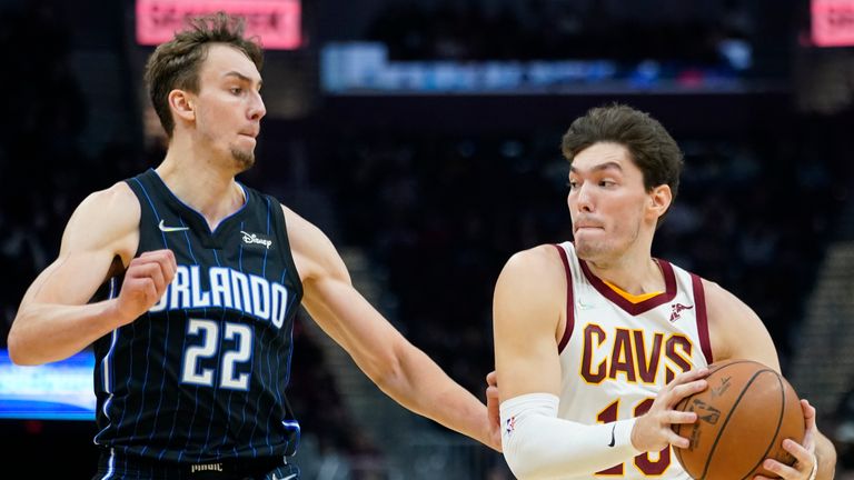 Cleveland Cavaliers&#39; Cedi Osman (16) drives against Orlando Magic&#39;s Franz Wagner (22) in the second half of an NBA basketball game, Saturday, Nov. 27, 2021, in Cleveland. (AP Photo/Tony Dejak)


