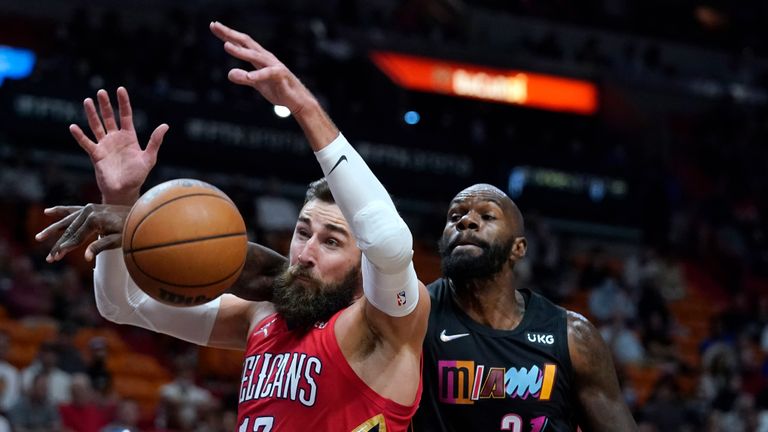 New Orleans Pelicans center Jonas Valanciunas (17) and Miami Heat center Dewayne Dedmon (21) go for a rebound during the first half of an NBA basketball game Wednesday, Nov. 17, 2021, in Miami. 