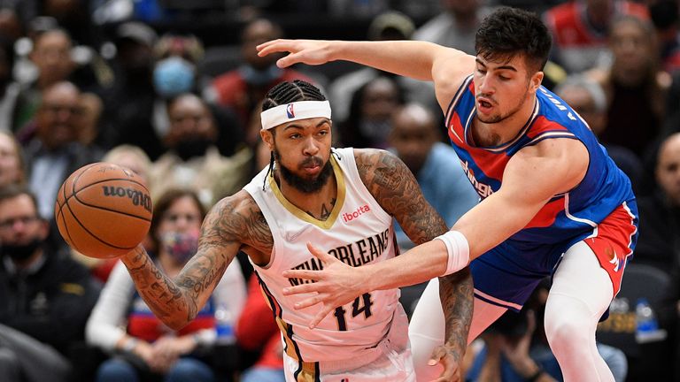 Washington Wizards forward Deni Avdija, right, grabs the ball against New Orleans Pelicans forward Brandon Ingram (14) during the second half of an NBA basketball game Monday, November 15, 2021, in Washington.  The Wizards won 105-100. 