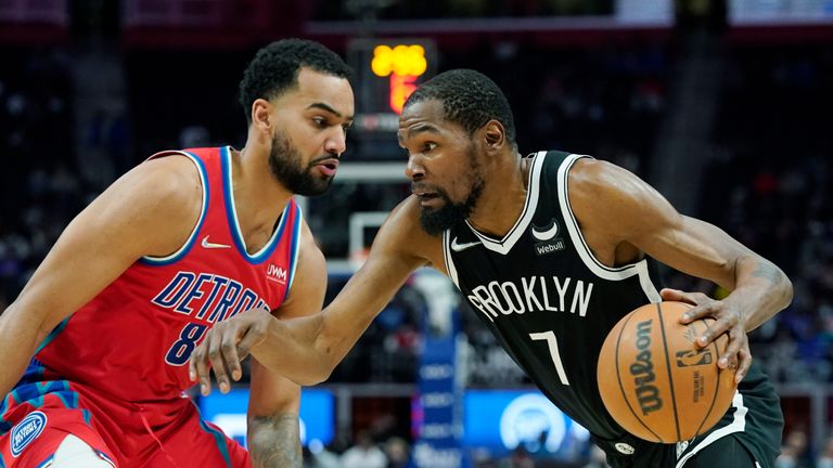 Brooklyn Nets forward Kevin Durant (7) drives as Detroit Pistons forward Trey Lyles (8) defends during the first half of an NBA basketball game, Friday, Nov. 5, 2021, in Detroit.