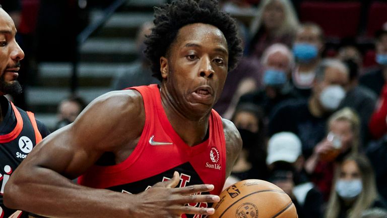 Toronto Raptors forward OG Anunoby, right, drives to the basket as Portland Trail Blazers forward Norman Powell defends during the first half of an NBA basketball game in Portland, Ore., Monday, Nov. 15, 2021.