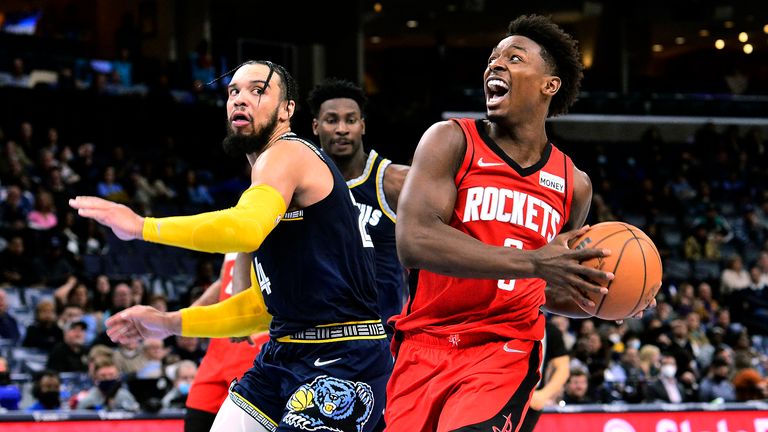 Houston Rockets forward Jae&#39;Sean Tate (8) drives next to Memphis Grizzlies forward Dillon Brooks during the first half of an NBA basketball game Monday, Nov. 15, 2021, in Memphis, Tenn. 