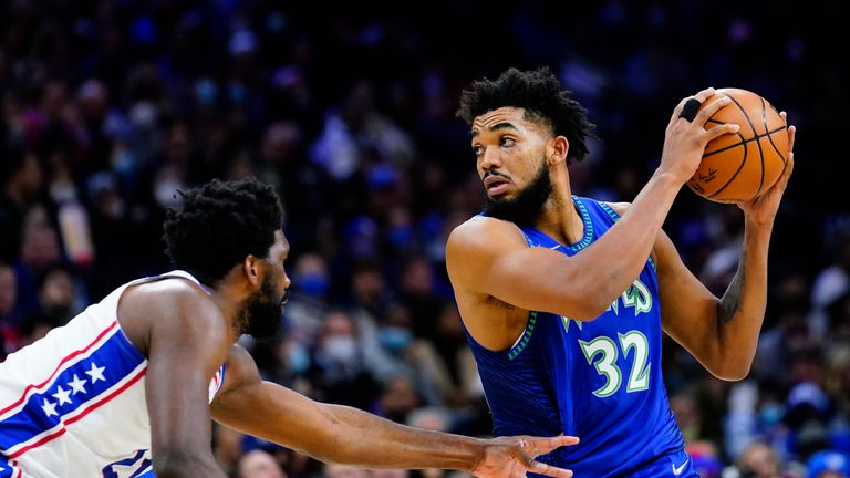 Minnesota Timberwolves&#39; Karl-Anthony Towns, right, tries to get past Philadelphia 76ers&#39; Joel Embiid during the first half of an NBA basketball game, Saturday, Nov. 27, 2021, in Philadelphia. (AP Photo/Matt Slocum)


