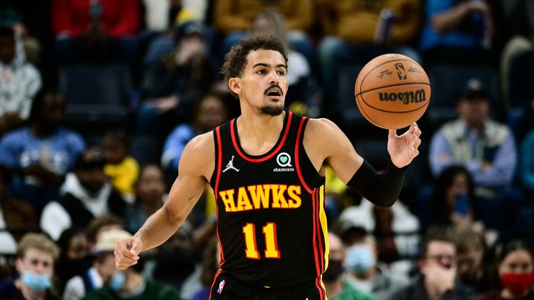 Atlanta Hawks guard Trae Young (11) brings the ball up court in the first half of an NBA basketball game against the Memphis Grizzlies Friday, Nov. 26, 2021, in Memphis, Tenn. (AP Photo/Brandon Dill)



