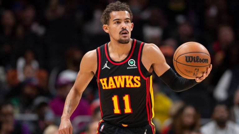 Atlanta Hawks guard Trae Young (11) dribbles up court during the first half of an NBA basketball game against the New York Knicks Saturday, Nov. 27, 2021, in Atlanta. (AP Photo/Hakim Wright Sr.)


