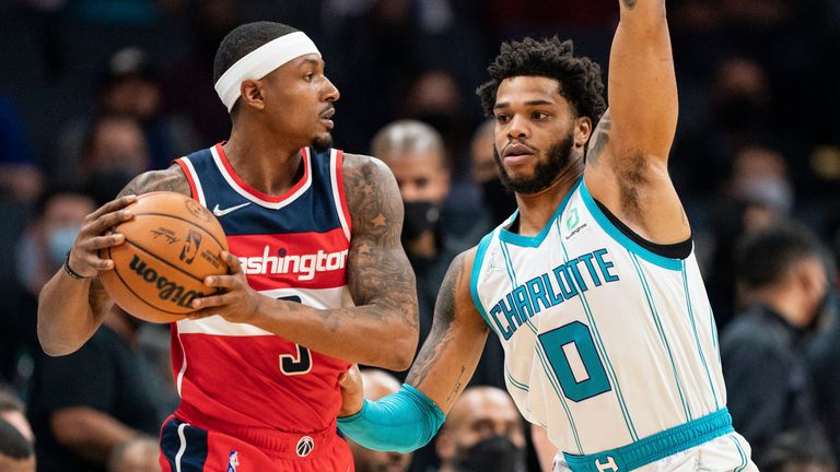 Charlotte Hornets forward Miles Bridges (0) guards Washington Wizards guard Bradley Beal (3) during the first half of an NBA basketball game in Charlotte, N.C., Wednesday, Nov. 17, 2021. 