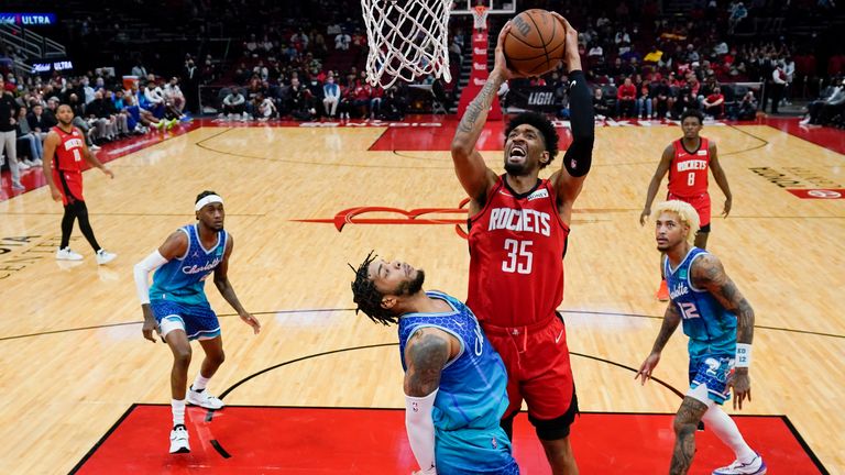 Houston Rockets center Christian Wood (35) shoots as Charlotte Hornets forward Miles Bridges, left, defends during the first half of an NBA basketball game, Saturday, Nov. 27, 2021, in Houston. (AP Photo/Eric Christian Smith)



