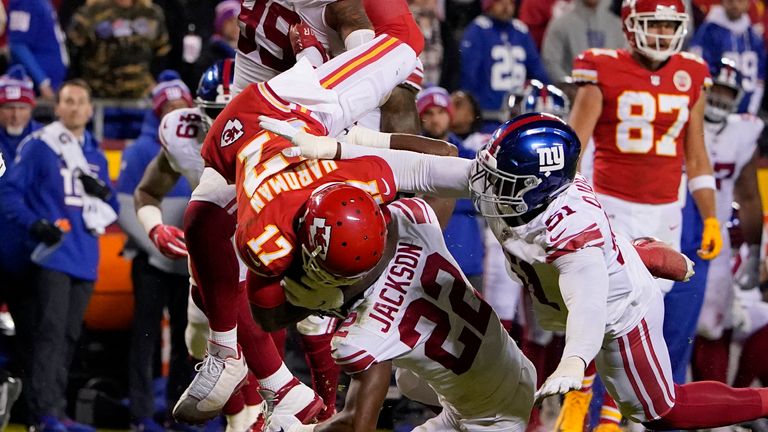 Kansas City Chiefs wide receiver Mecole Hardman (17) is upended by New York Giants defensive end Leonard Williams (99), safety Julian Love (20) and linebacker Azeez Ojulari (51) after running for a long gain during the second half of an NFL football game Monday, Nov. 1, 2021, in Kansas City, Mo. The Chiefs won 20-17. 