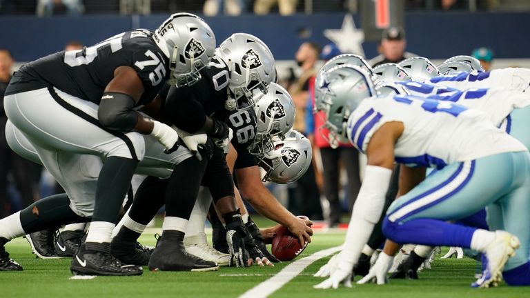 Las Vegas Raiders line of scrimmage during a Thanksgiving day NFL football game against the Dallas Cowboys, Thursday, Nov. 25, 2021, in Arlington, Texas. 