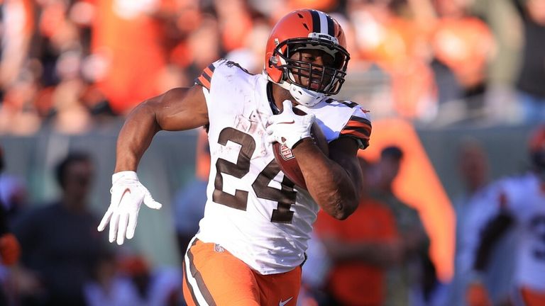 Cleveland Browns&#39; Nick Chubb (24) runs past Cincinnati Bengals&#39; Vonn Bell (24) for a touchdown during the second half of an NFL football game