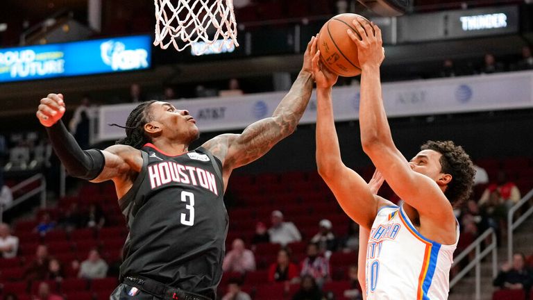 Oklahoma City Thunder forward Jeremiah Robinson-Earl, right, shoots as Houston Rockets guard Kevin Porter Jr. (3) defends during the first half of an NBA basketball game, Monday, Nov. 29, 2021, in Houston. (AP Photo/Eric Christian Smith)


