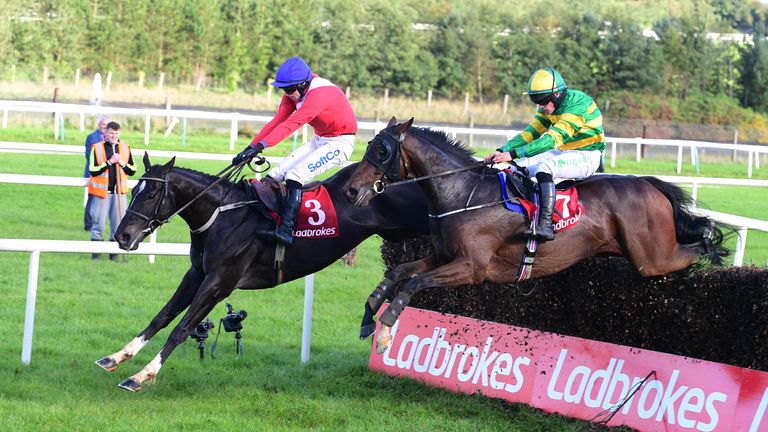 Ontheropes and Sean O'Keeffe (far) jump the last to win the Munster National from A Wave Of The Sea