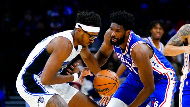 &#39;s Wendell Carter Jr., left, and &#39; Joel Embiid battle for the ball during the first half of an NBA basketball game, Monday, Nov. 29, 2021, in Philadelphia. (AP Photo/Matt Slocum)