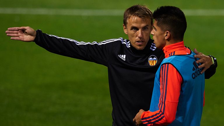 Phil Neville in conversation with Joao Cancelo at Valencia in 2015