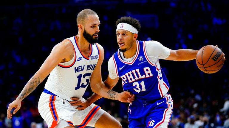 Philadelphia 76ers' Seth Curry, right, tries to get past New York Knicks' Evan Fournier during the second half of an NBA basketball game, Monday, Nov. 8, 2021, in Philadelphia. (AP Photo/Matt Slocum)