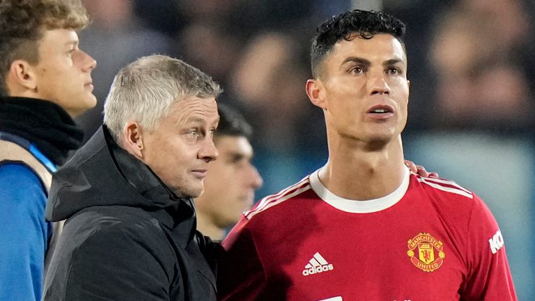 Manchester United manager Ole Gunnar Solskjaer approaches Manchester United's Cristiano Ronaldo at the end of the Champions League Group F soccer match between Atalanta and Manchester United, at Stadio di Bergamo, in Bergamo, Italy, Tuesday, Nov. 2, 2021. The match ended in a 2-2 draw. .  (AP Photo/Luca Bruno)
