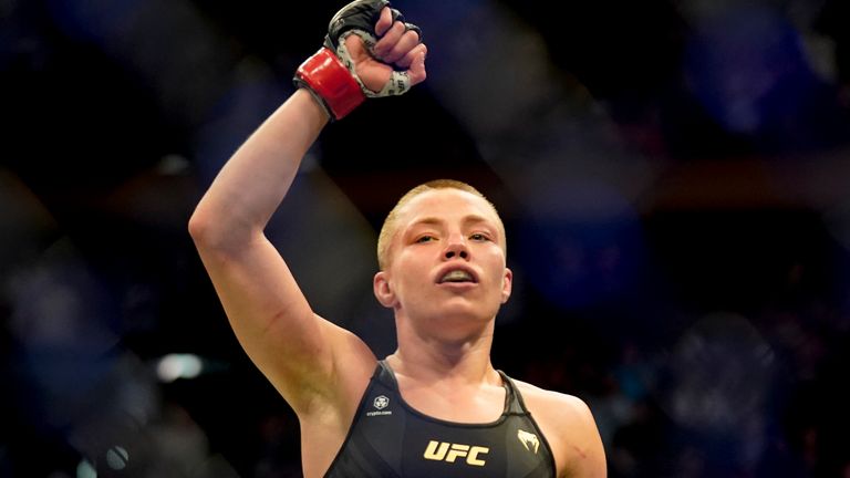 Rose Namajunas reacts after defeating Weili Zhang during a straw weight mixed martial arts championship bout at UFC 268