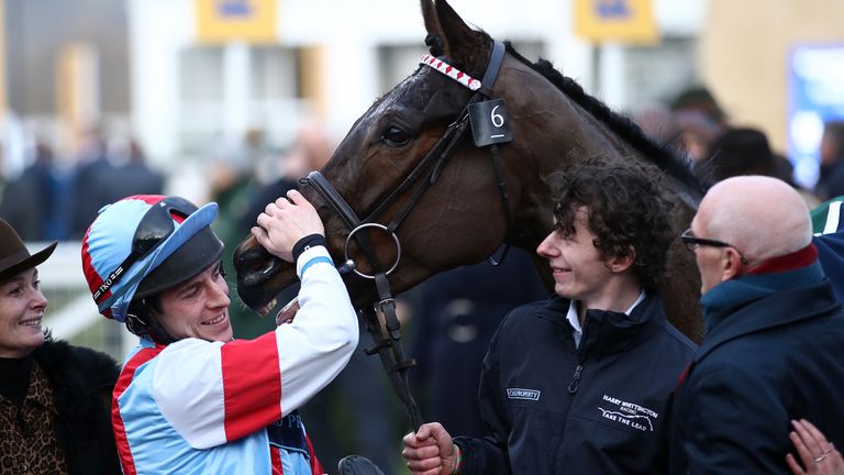 Gavin Sheehan gives Simply The Betts a well deserved pat after victory at the 2020 Cheltenham Festival