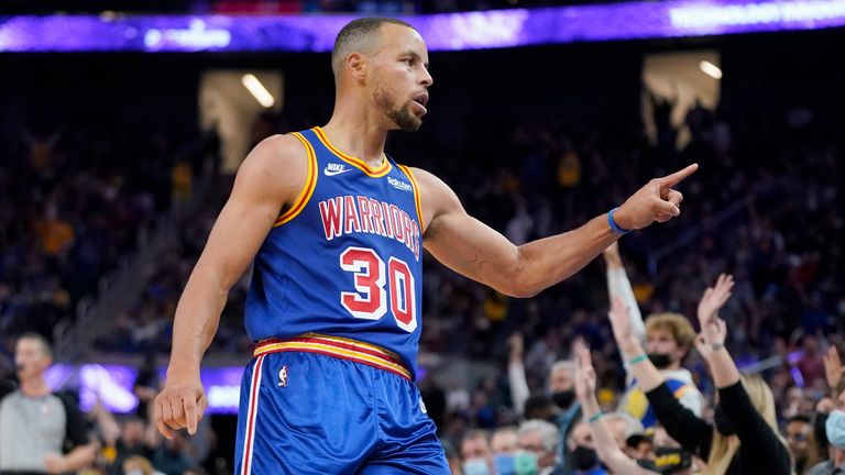 Golden State Warriors guard Stephen Curry gestures toward fans after shooting a 3-point basket against the Chicago Bulls