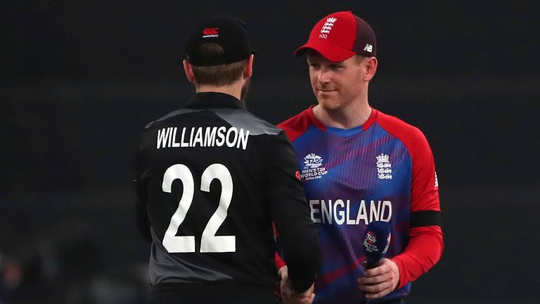 England's captain Eoin Morgan, right, greets New Zealand's captain Kane Williamson after Williamson won the toss ahead of the Cricket Twenty20 World Cup semi-final match between England and New Zealand in Abu Dhabi.