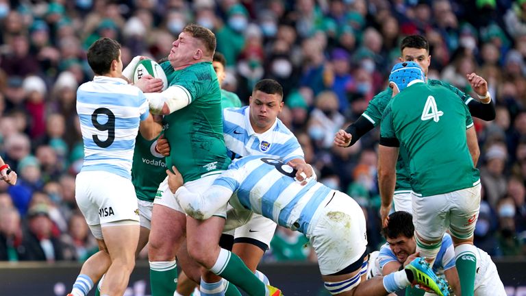 Tadhg Furlong is tackled by Argentina's Tomas Cubelli and Pablo Matera